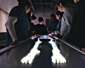 Students looking at display