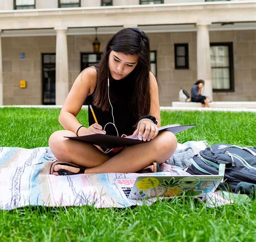 Student sitting in lawn
